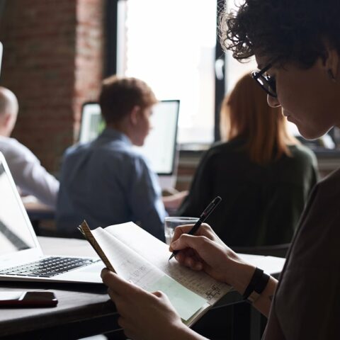 woman writing on her notebook 3184656