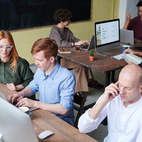 photo of man in front of computer 3182748