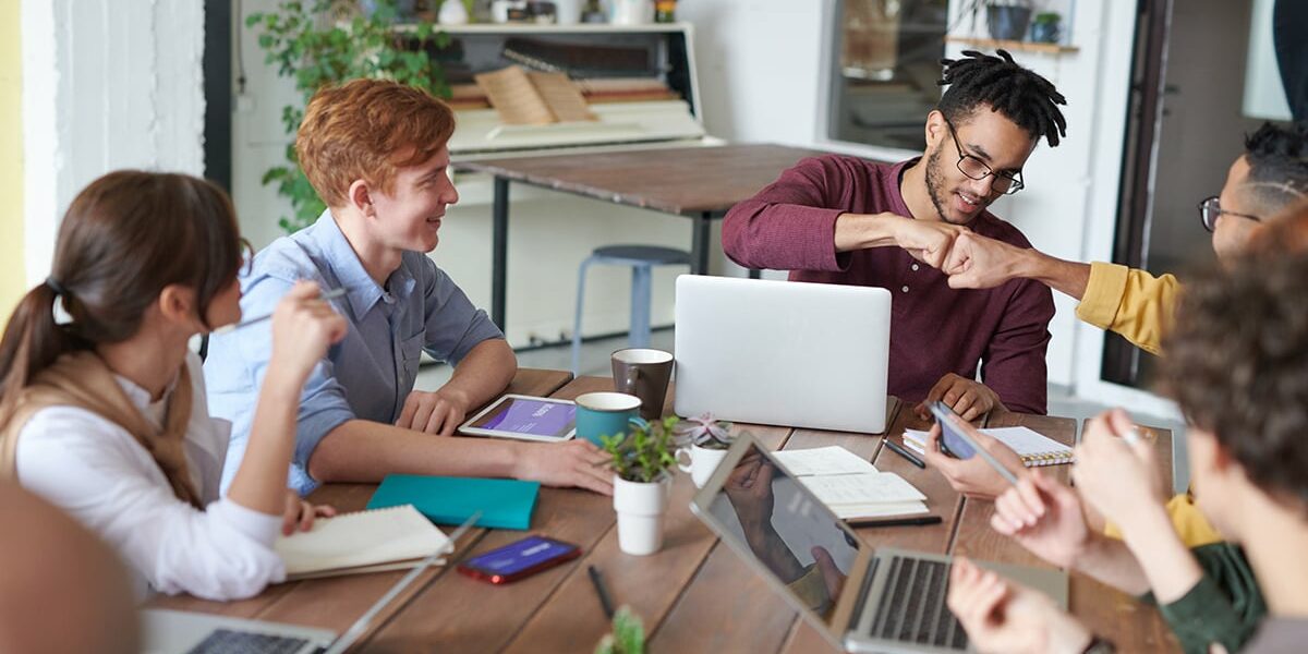 photo of men doing fist bump 3184302